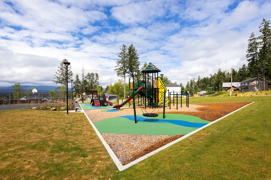 The playground surface design echoes themes from K’ómoks First Nation’s vision and community culture.