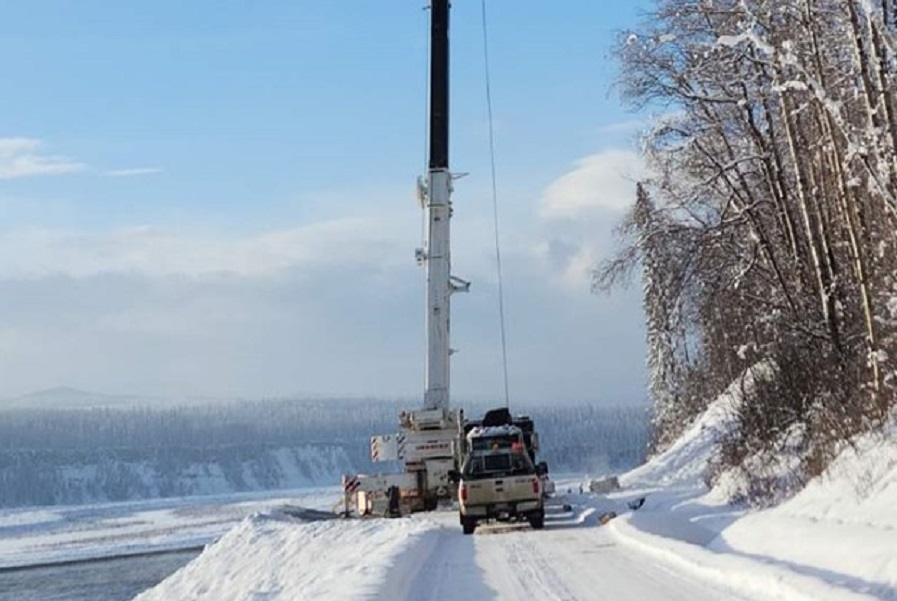 Trucks parked on a snow-covered road